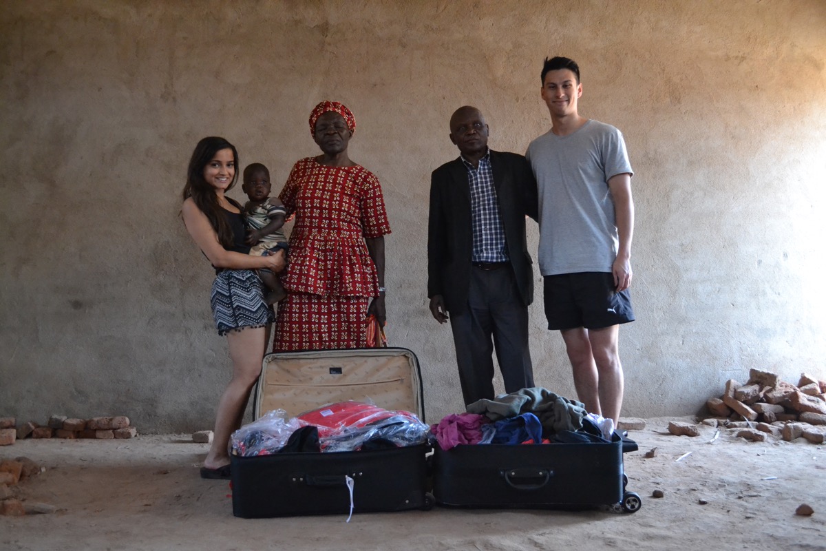 Volunteers unpacking donated clothes with Margaret