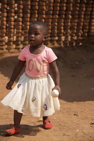 Young girl wearing a pink LOVE shirt at Chikondi