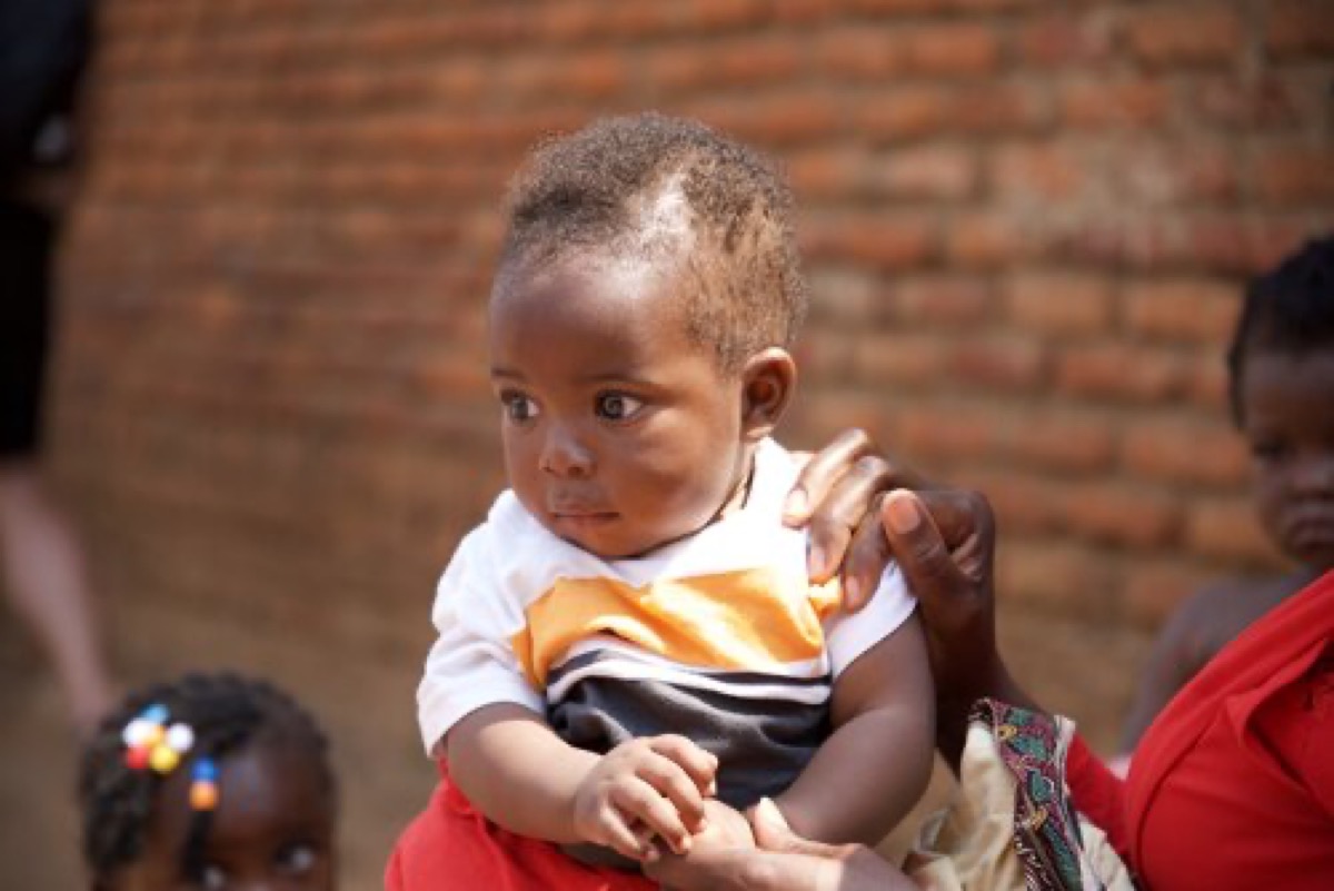 Baby being held at Chikondi orphanage